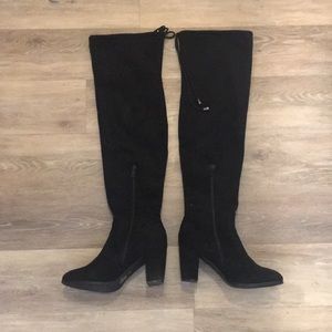 Tall heeled stretchy knee boots